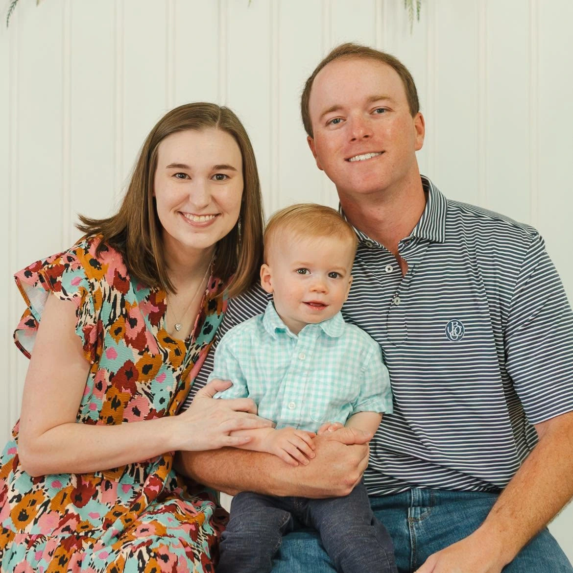 Carolina Builders owner Ben Catoe with his wife and child